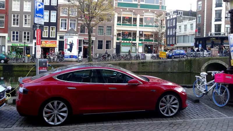 Charging red Tesla Model S in Amsterdam
