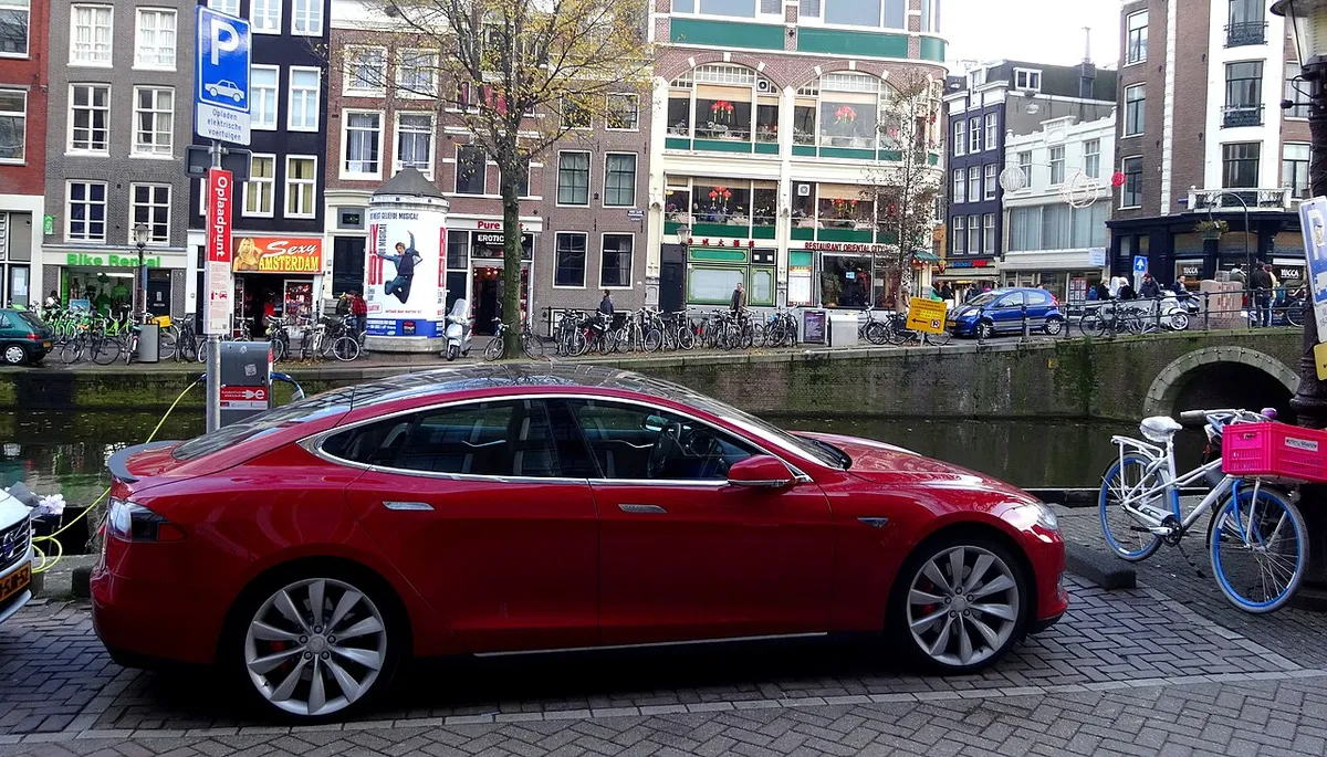 Charging red Tesla Model S in Amsterdam