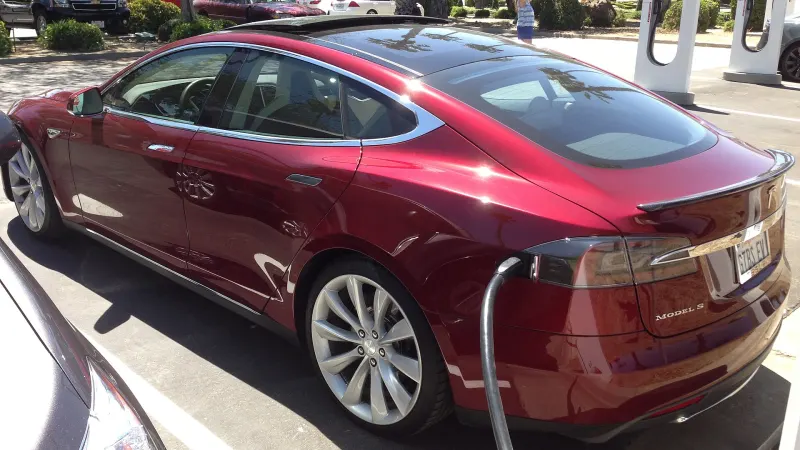 Tesla Model S plugged in at a Supercharger station