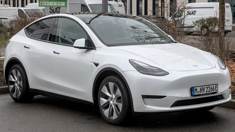 A Tesla Model Y photographed from the front three-quarter angle