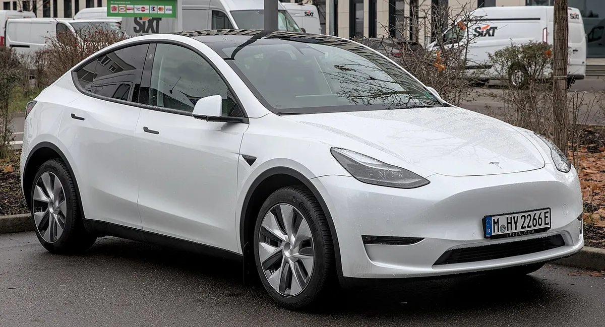 A Tesla Model Y photographed from the front three-quarter angle